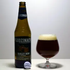 Butelka i kielich z ciemnym piwem barley wine "Po Godzinach". Etykieta informuje o edycji limitowanej.
